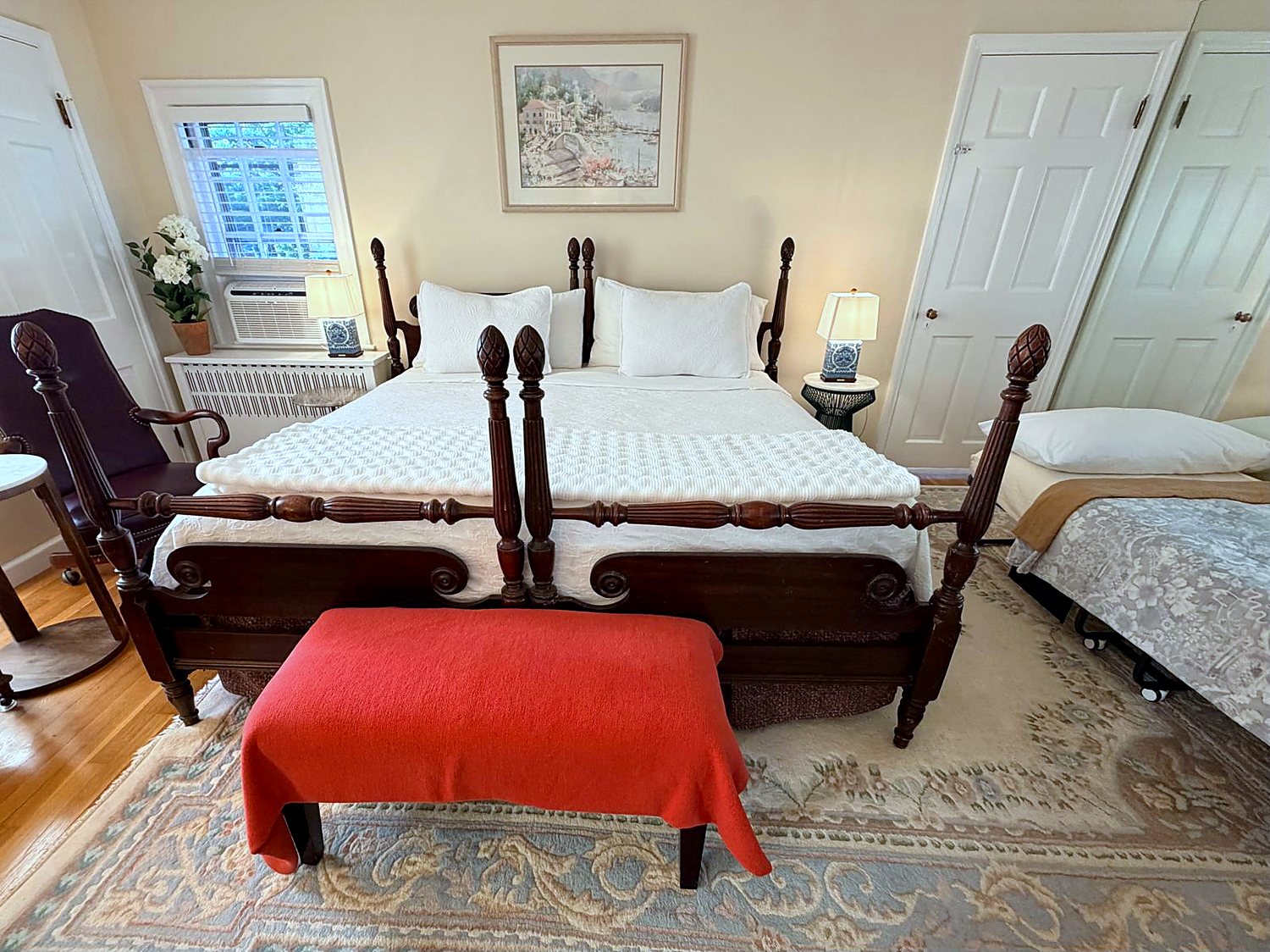 The Two-Room Suite at Wellesley Boutique Inn, with a four-poster king bed formed from two permanently joined twin beds